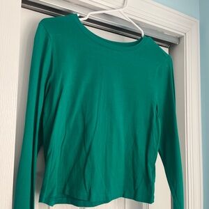 Green cropped long sleeve top.